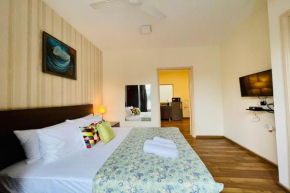 BluO 1BHK Cyberpark - BathTub, Patio, Gym, TT